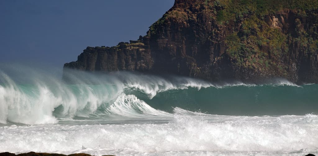 Secret Beach, Northern Kauai with big winter waves from Japan. Kauapea Beach.