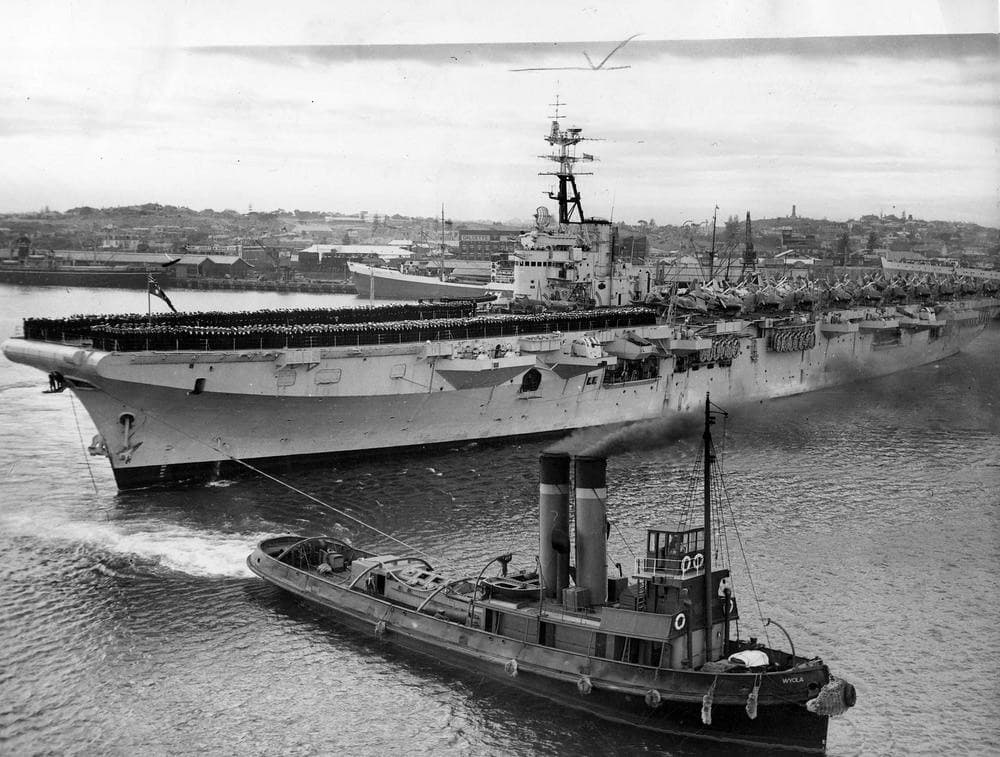 May 12, 1949: the RAN's first modern carrier at Fremantle, with historic tug WYOLA  - Argus Collection, SLV.