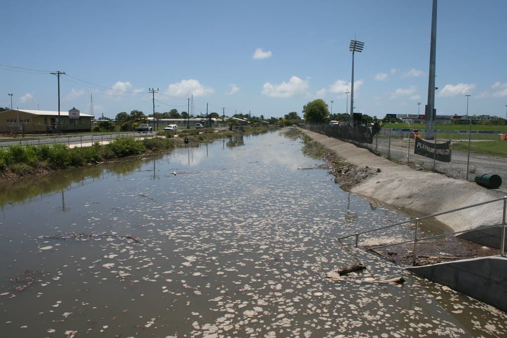 Drain Bridge Road Mackay near Illawong Beach East Mackay  Bridge Road is a major road & runs east west from Illawong Beach through Sth Mky to West Mky. Water in photo is from high tide as Mky has had very little rain, well below the Jan average
