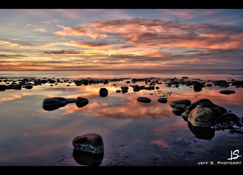 An evening at the beach during a sunset