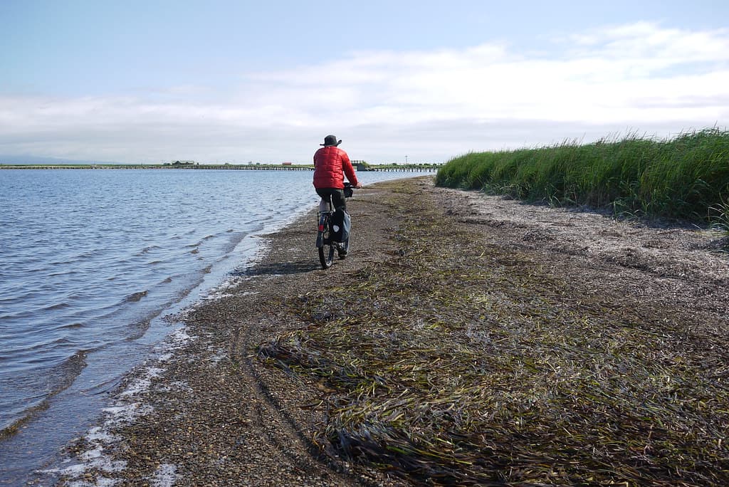 Cycling along the beach on the  Notsuke Peninsula (Hokkaido, Japan)