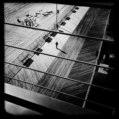 From the B&W challenge day #6 #jcp #iphone #hipstamatic #longbeach #allegria #blackandwhite #man #walking #boardwalk #beach #sea #atlantic