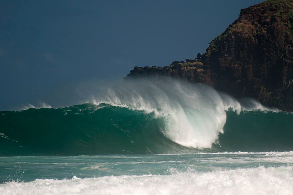 Secret Beach, Northern Kauai with big winter waves from Japan. Kauapea Beach.