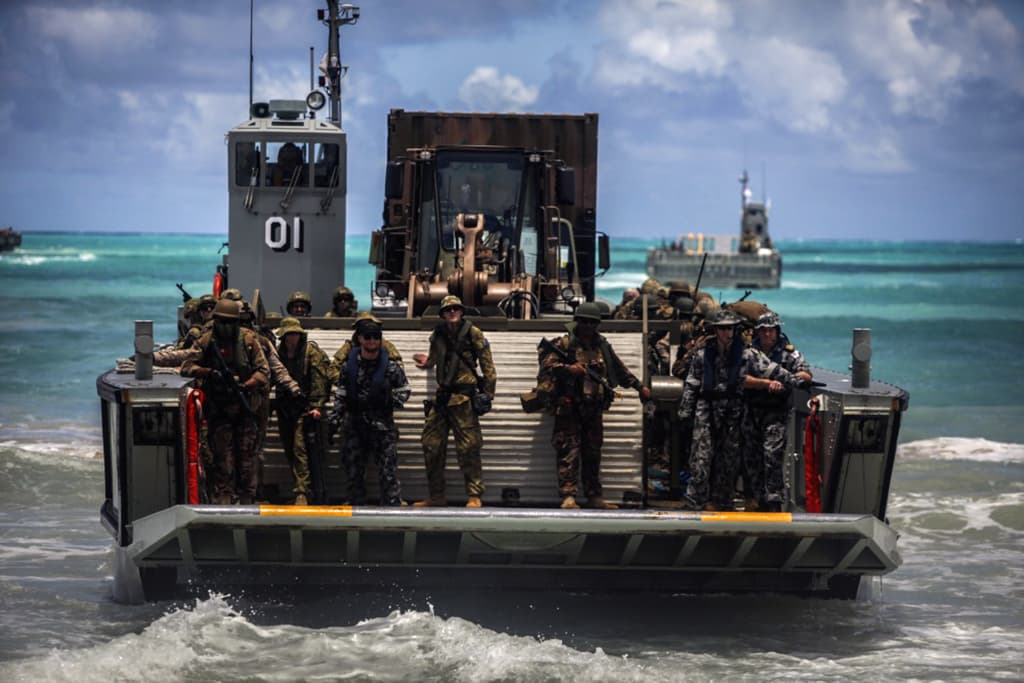 Australian, New Zealand, Togan, and U.S. Marines participate in amphibious assault training during RIMPAC 2016