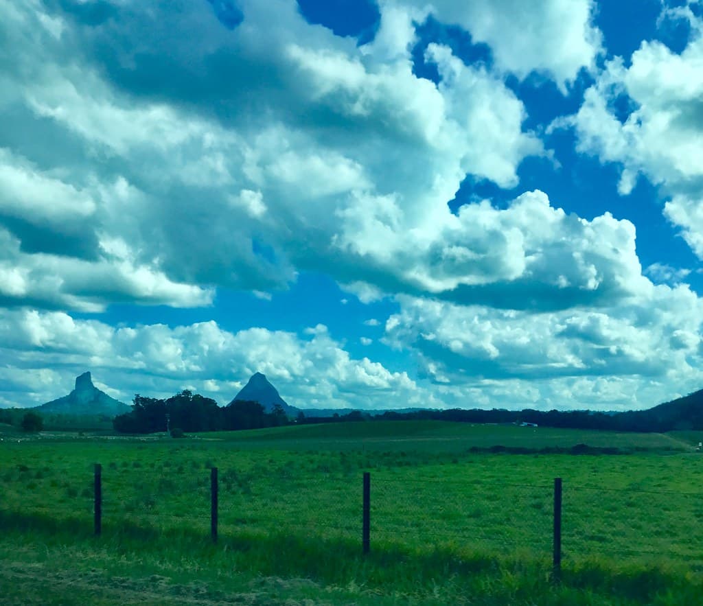 Glasshouse Mountains. Old volcanic plugs seen on the Rockhampton Tilt Train.